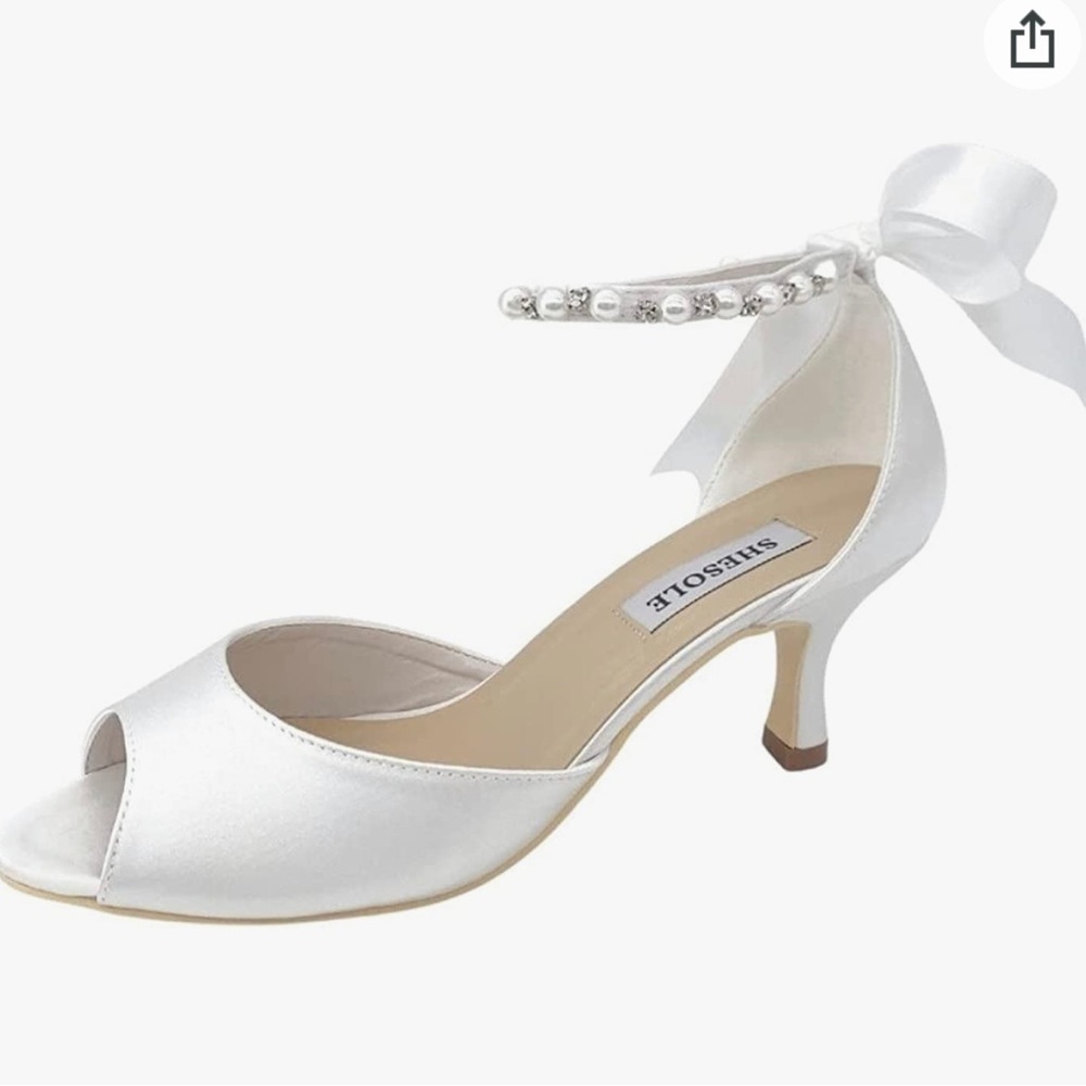 Shesole white pumps